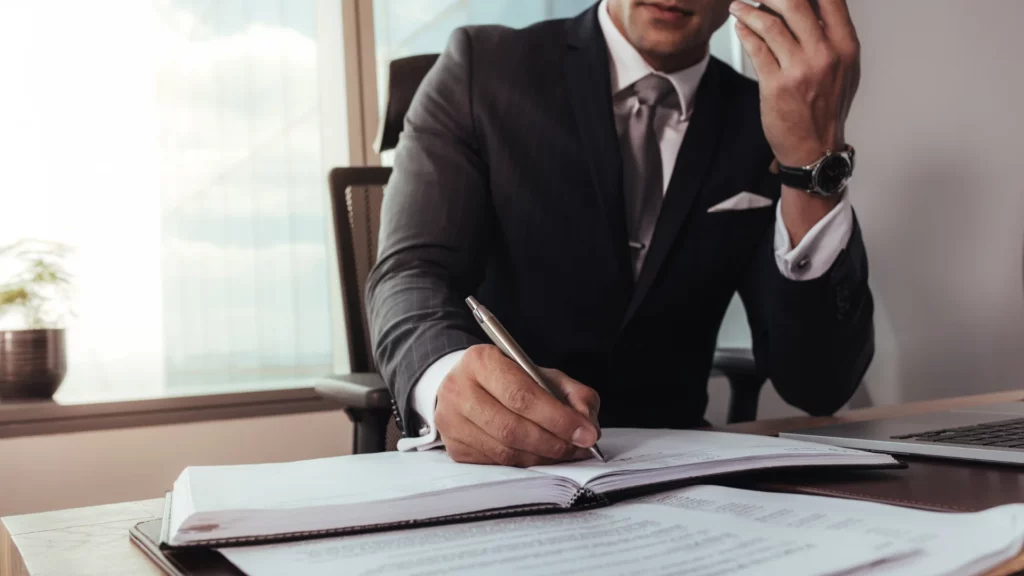 a cruise ship injury lawyer signing documents related to a cruise ship sexual assault