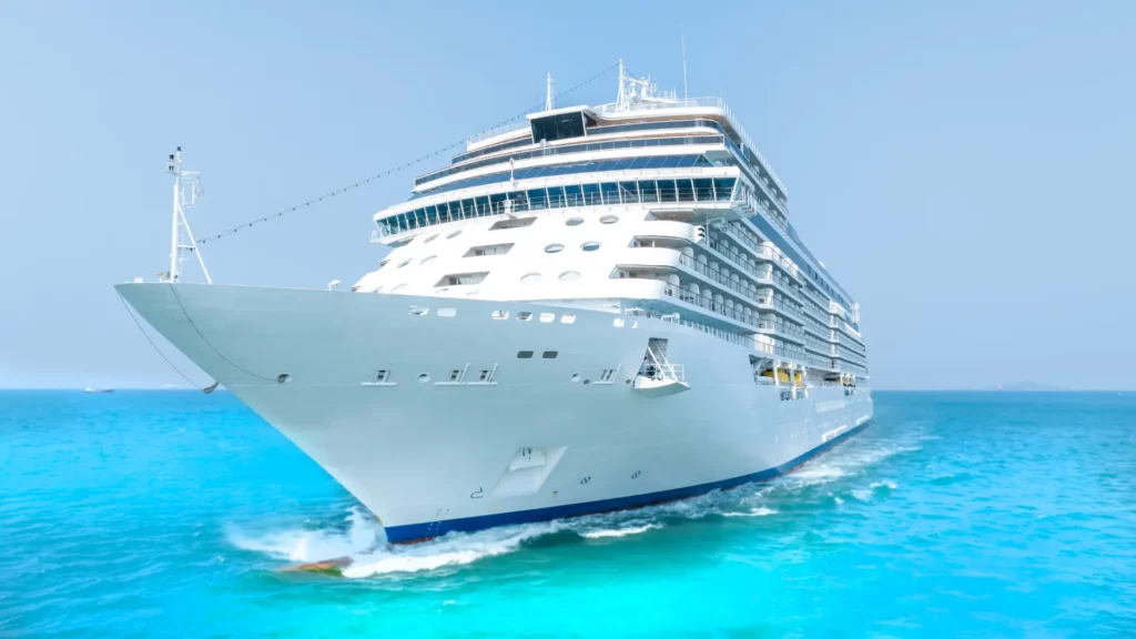 cruise ship sailing through clear turquoise waters